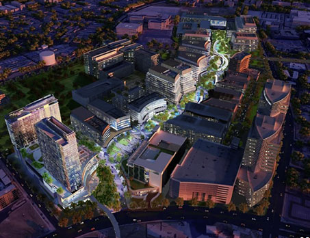 Aerial view of Insight Surgery's modern medical complex illuminated at night.